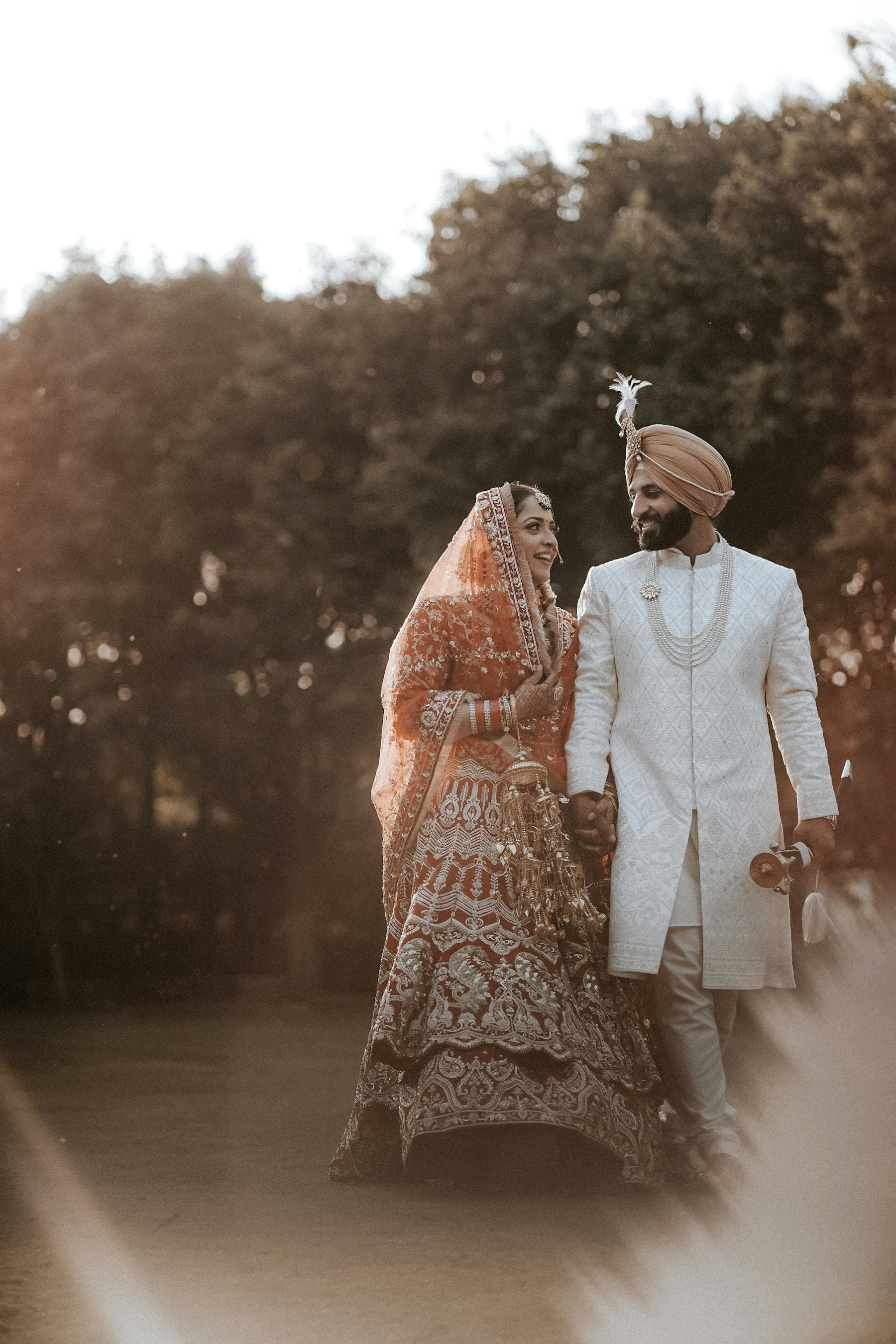 An Indian family reviewing a marriage proposal together — parents looking warmly at a phone